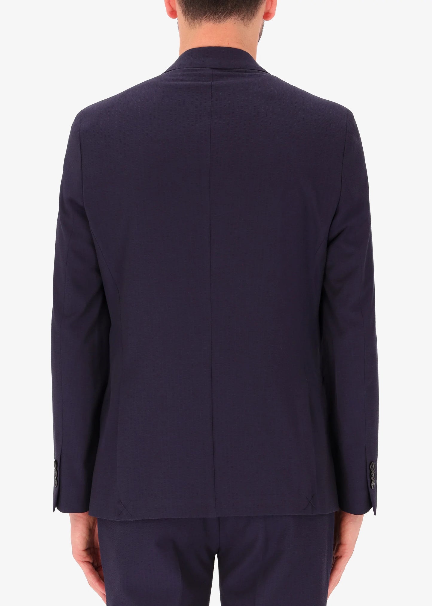 A back facing image of a model wearing Distretto 12 Double BreastedTailoring tech Firenze Jacket.