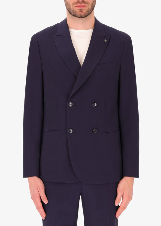 A front facing image of a model wearing Distretto 12 Double BreastedTailoring tech Firenze Jacket.