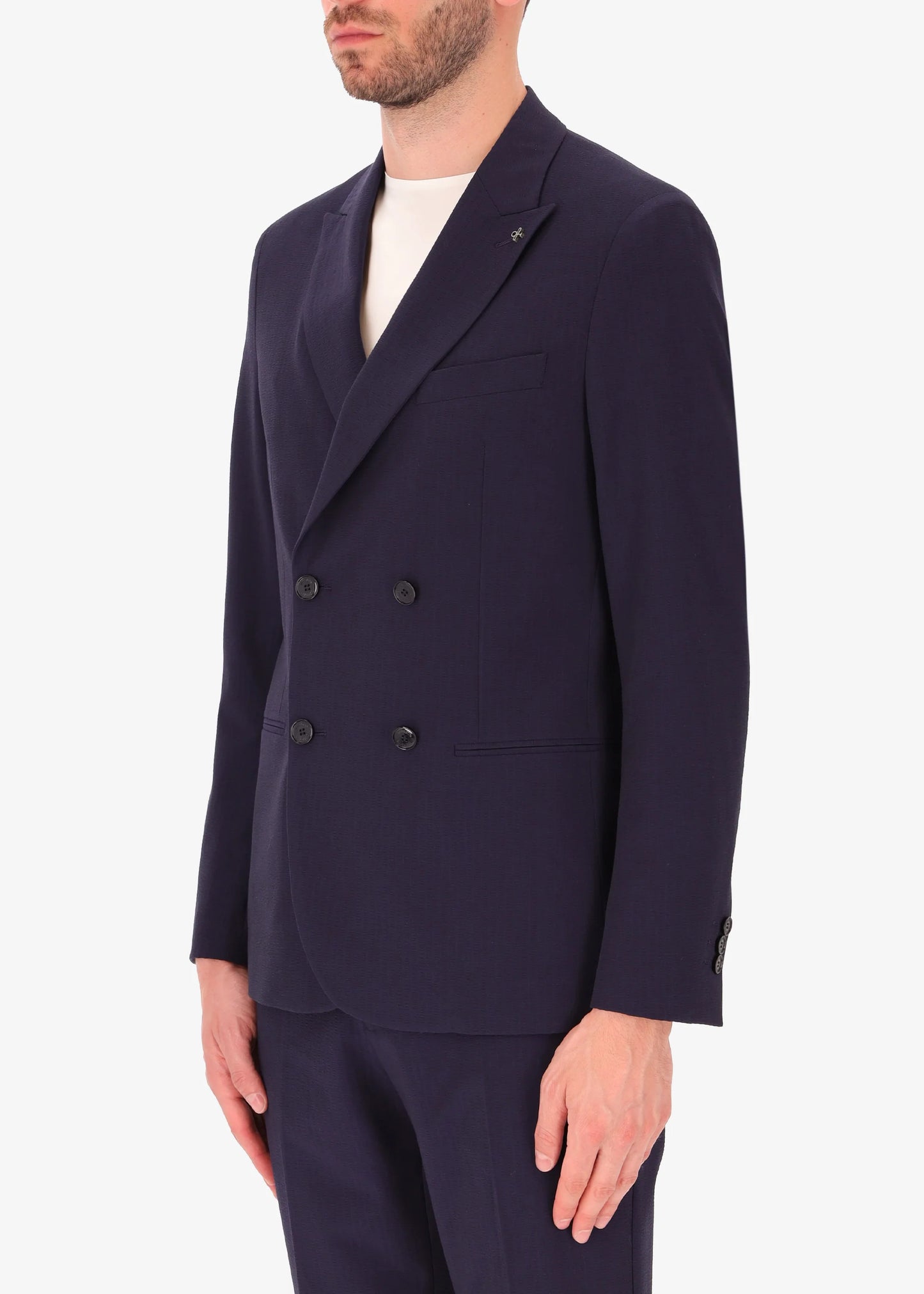 A side facing image of a model wearing Distretto 12 Double Breasted Tailoring tech Firenze Jacket.