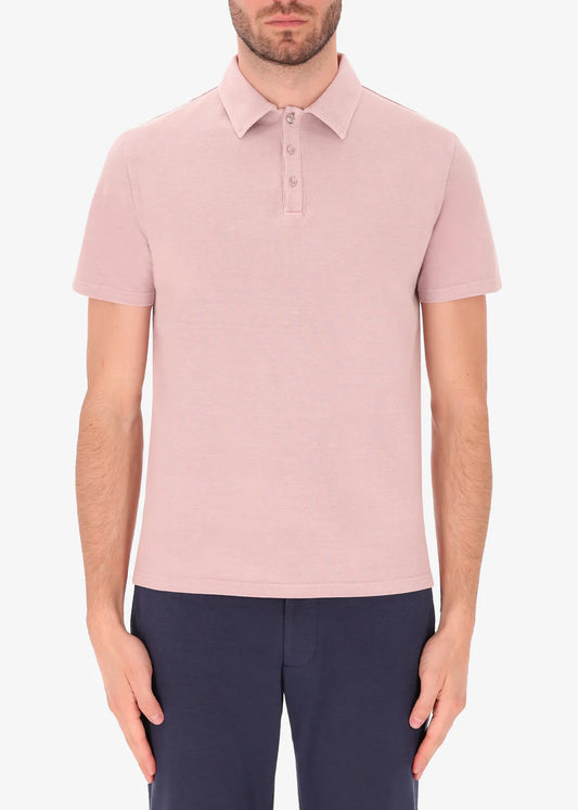 An image of a model wearing polo versilia in pink from Distretto 12.