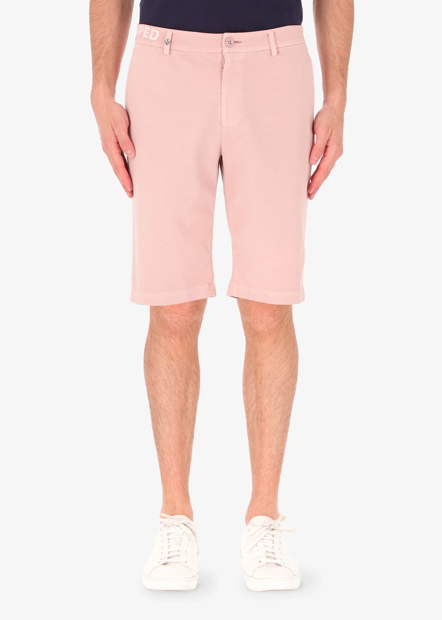 An image of a model wearing shorts in pink from Distretto 12.