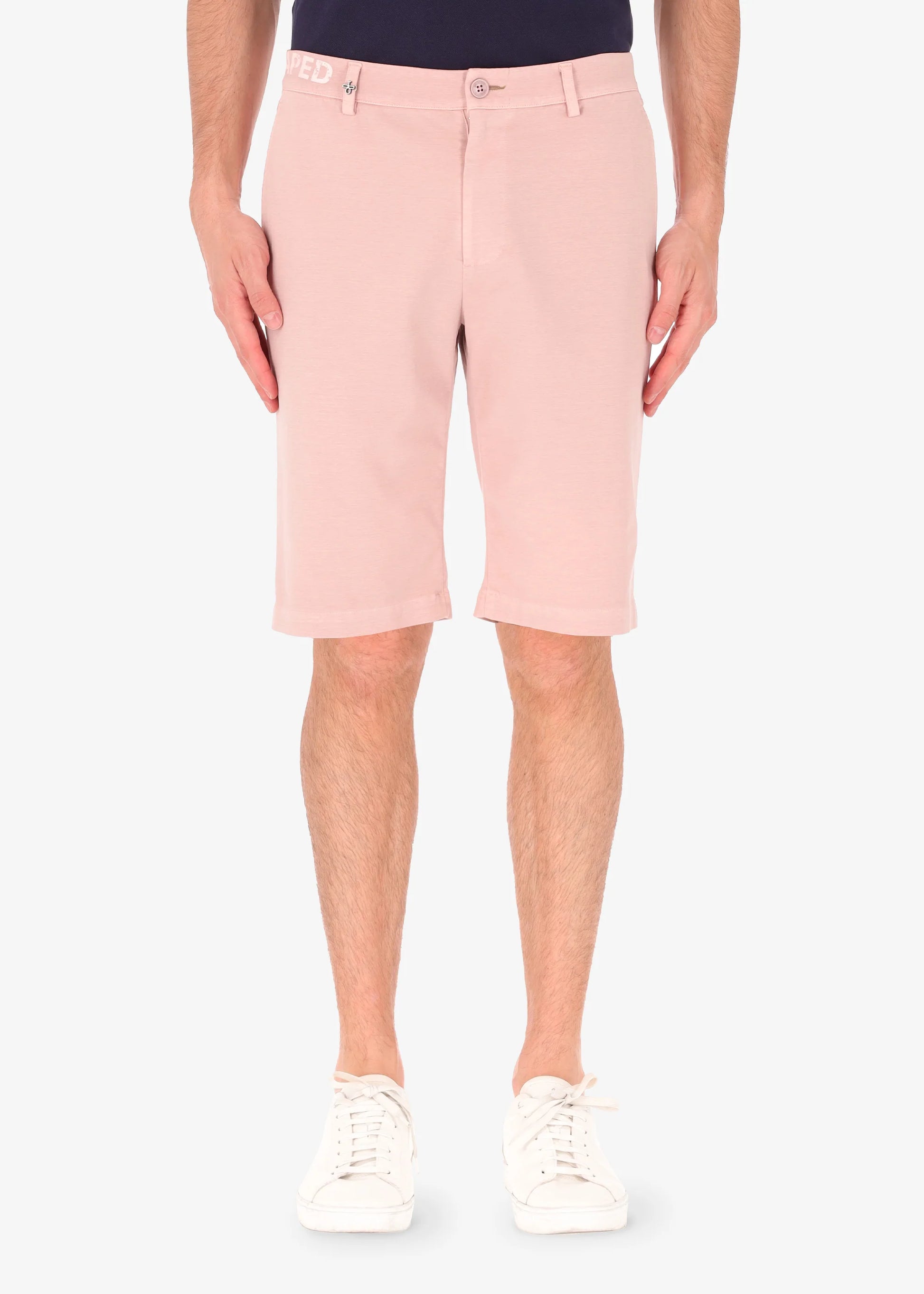 An image of a model wearing shorts in pink from Distretto 12.