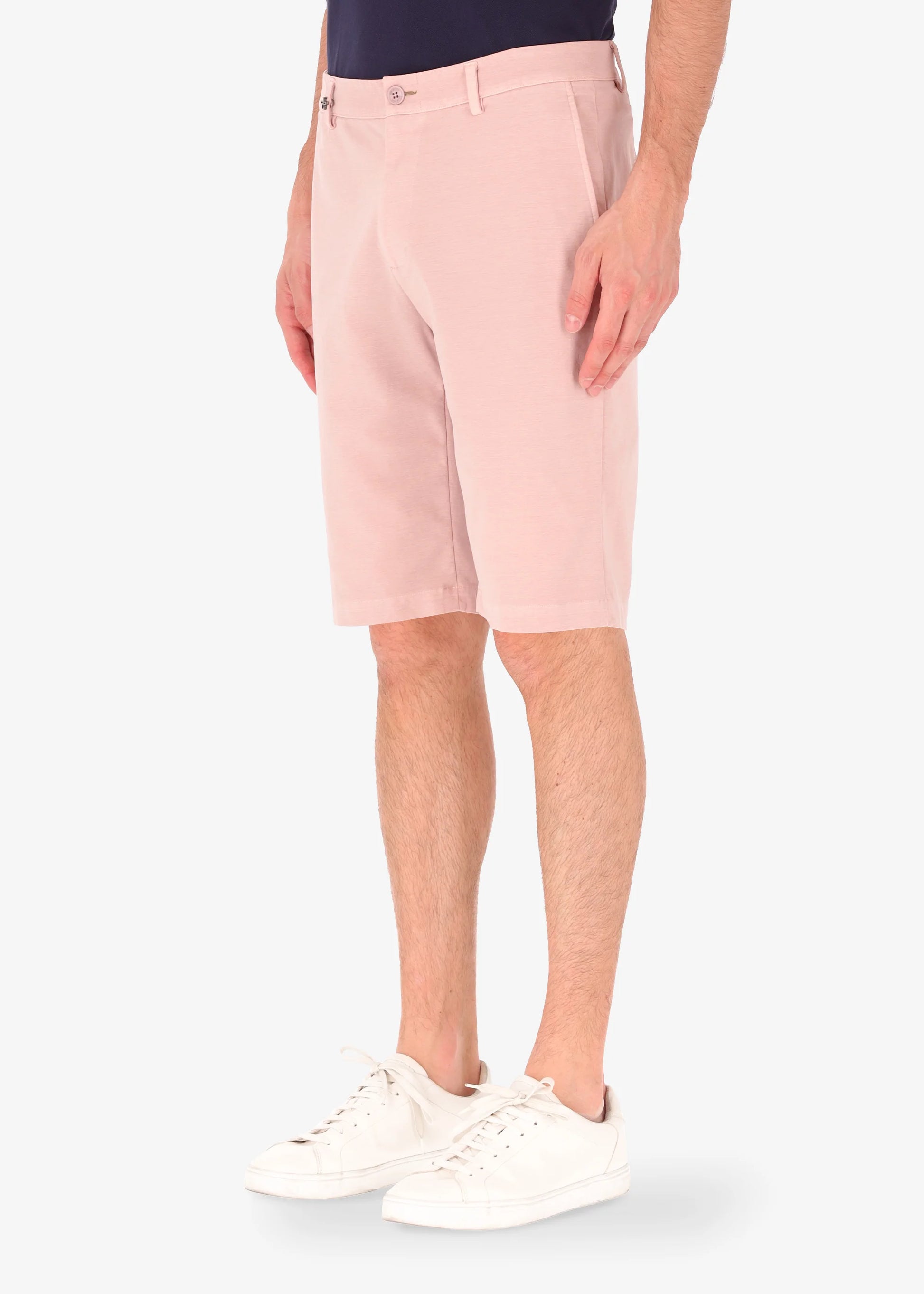 An image of a model wearing shorts in pink from Distretto 12.