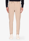 An image of a model wearing Distretto12 cargo newman trousers in cream.