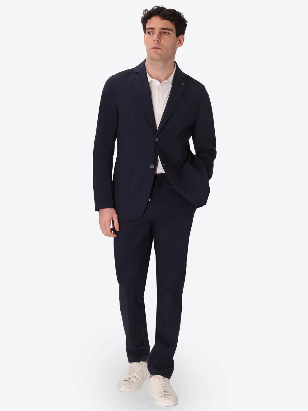 A man wearing Distretto 12 Jacket grano in navy as a suit.